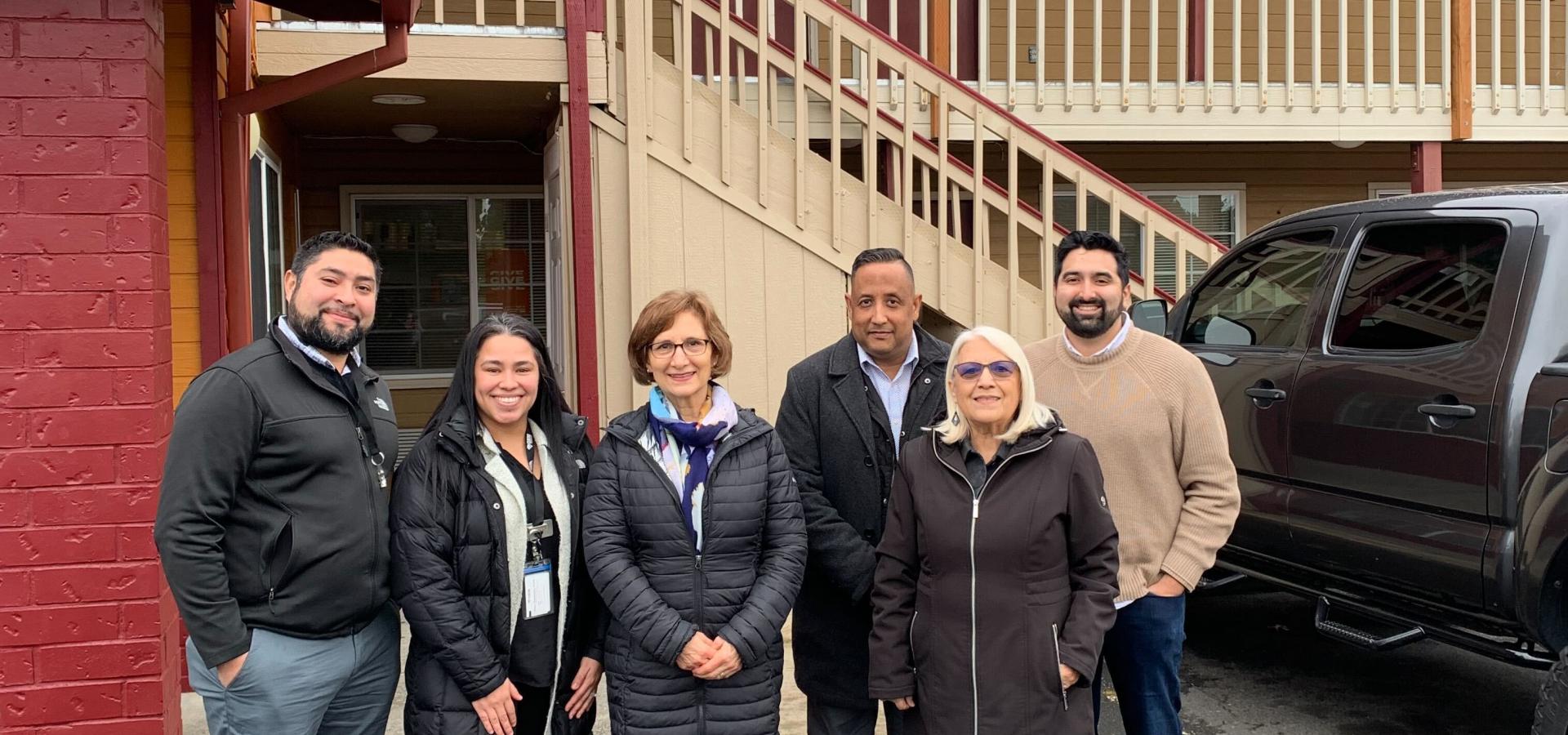 Congresswoman Bonamici stands with representatives from Centro Cultural at Casa Amparo, a Project Turnkey site.